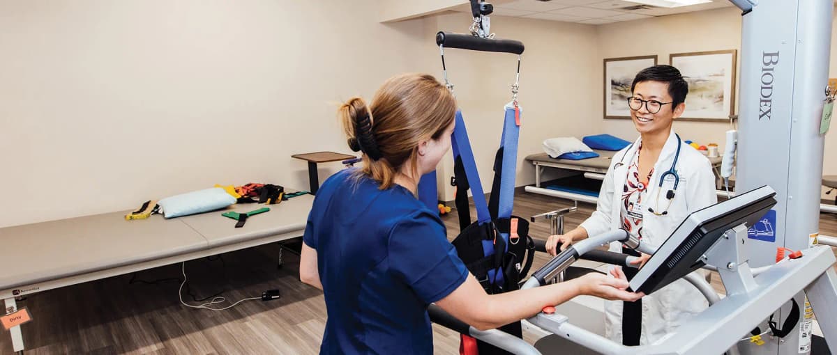 Healthcare professional helping elderly patient