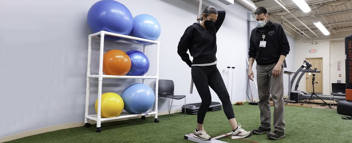 Physical therapist working with patient